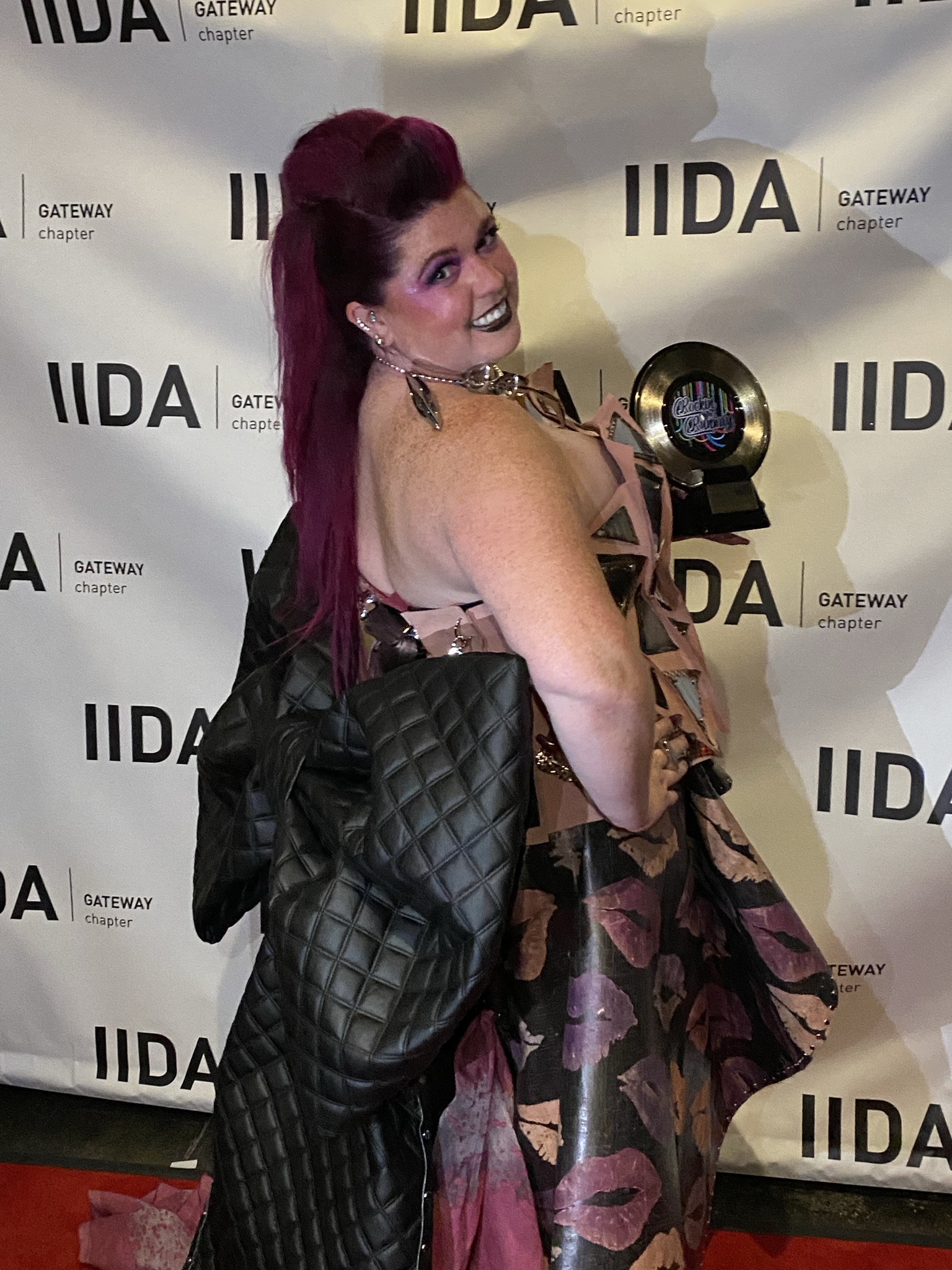 Katie Hepting showing off the back of her dress on the IIDA red carpet
